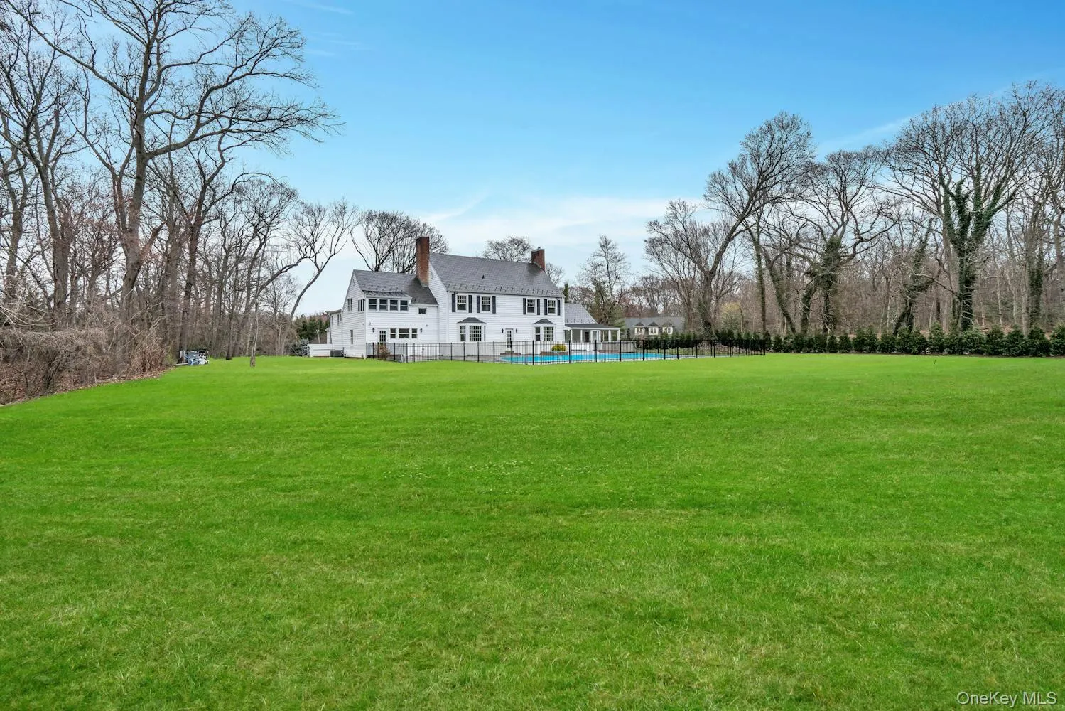 View of yard with a fenced in pool and fence View of yard with a fenced in pool and fence