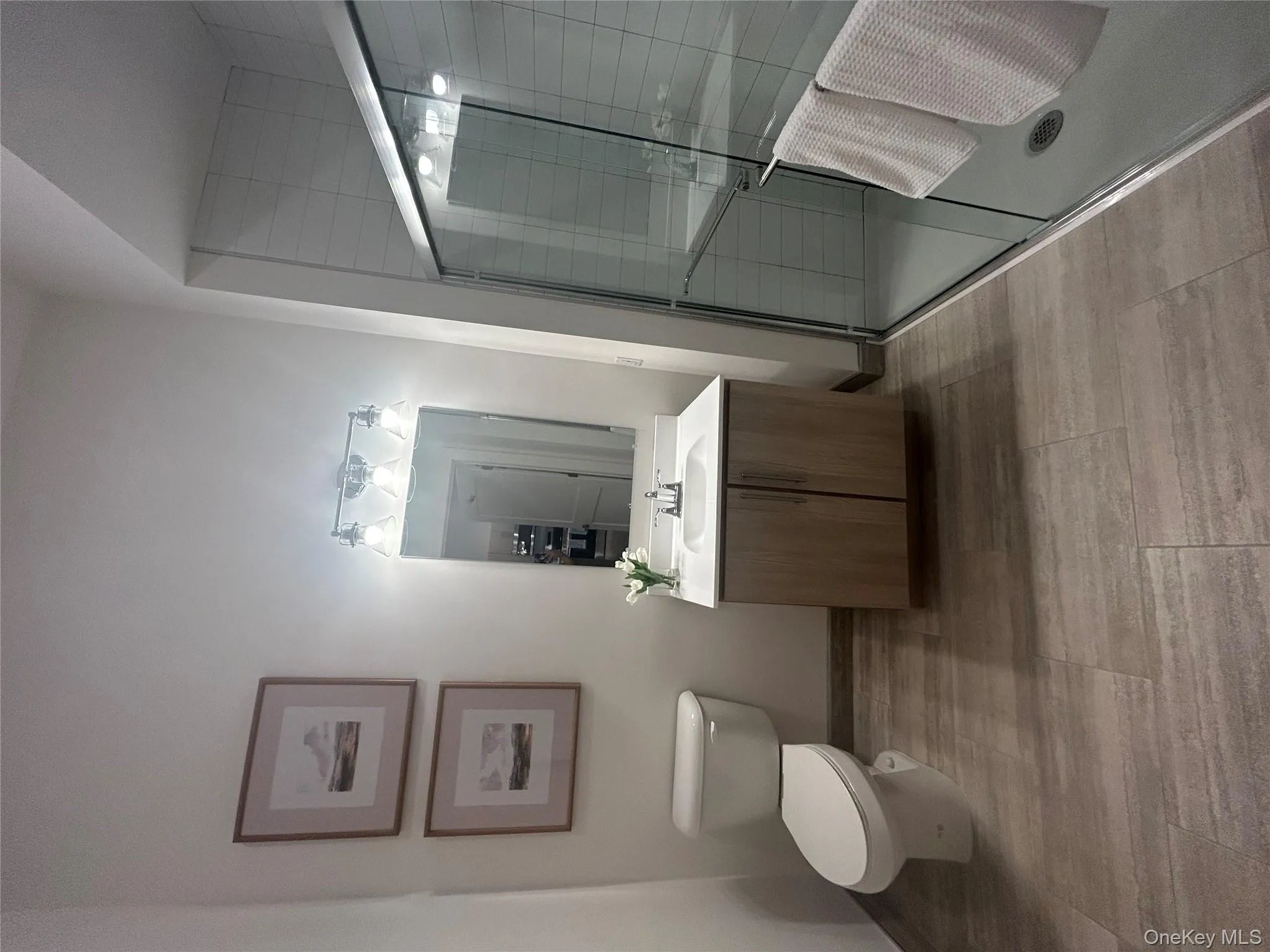 Bathroom featuring vanity and a stall shower Bathroom featuring vanity and a stall shower