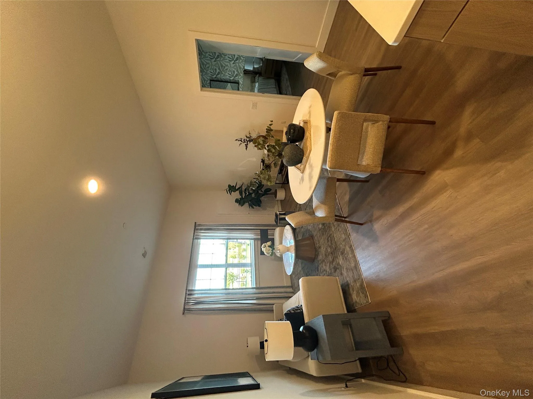 Dining room with recessed lighting and dark wood finished floors Dining room with recessed lighting and dark wood finished floors