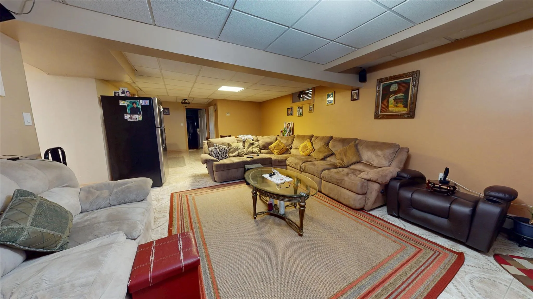 Living area with a paneled ceiling Living area with a paneled ceiling
