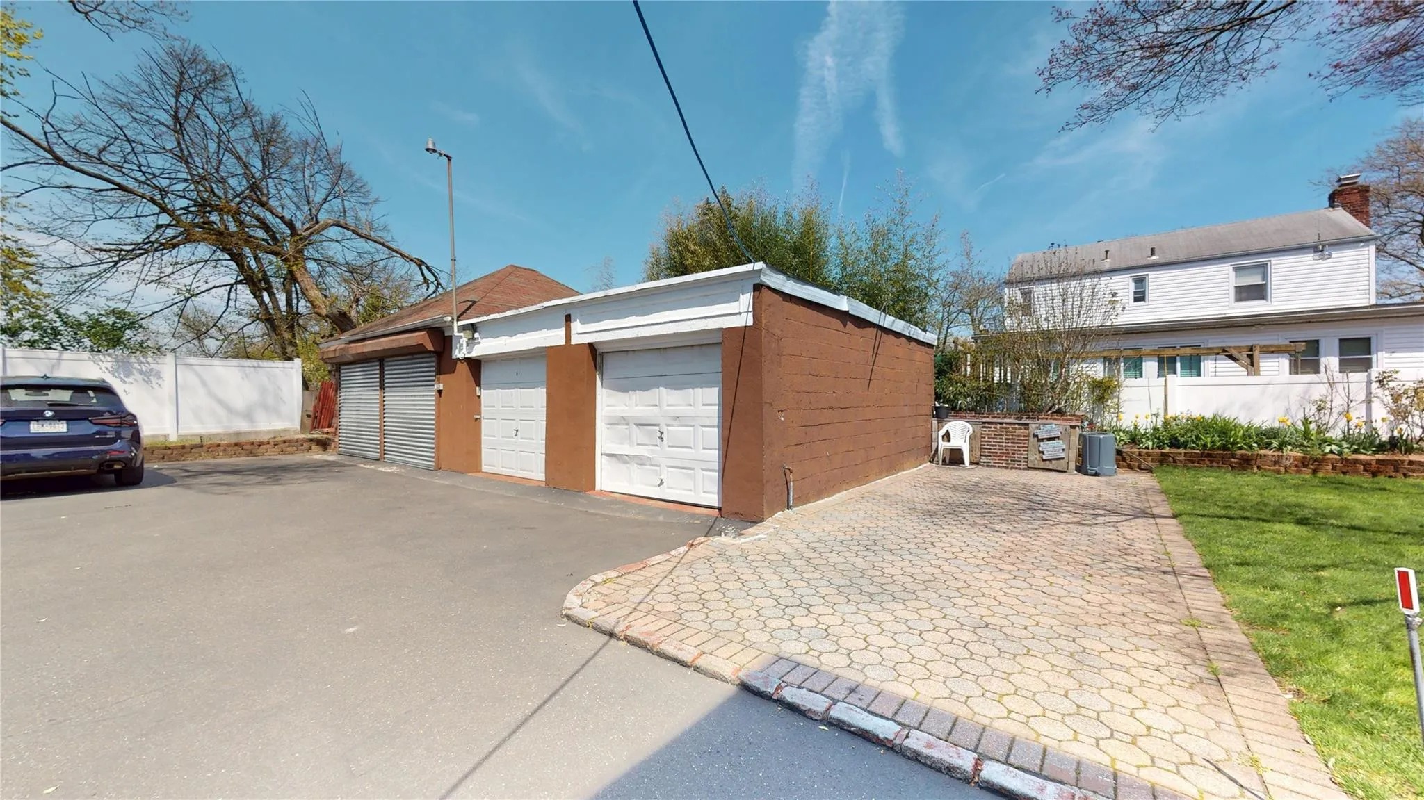 Detached garage featuring fence Detached garage featuring fence