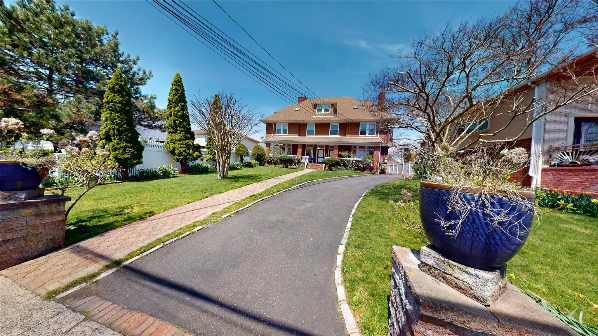 View of front of house with fence, brick siding, and a front lawn View of front of house with fence, brick siding, and a front lawn
