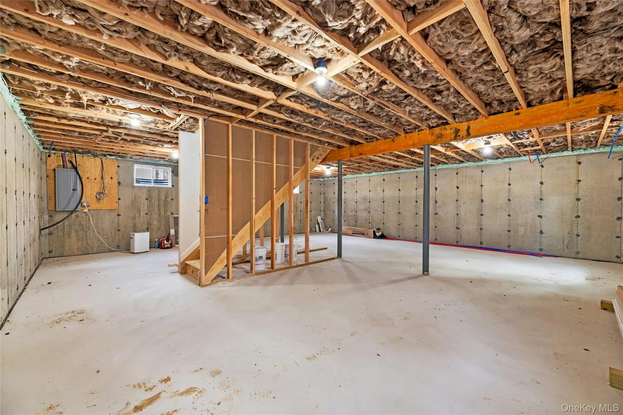 Basement featuring electric panel Basement featuring electric panel