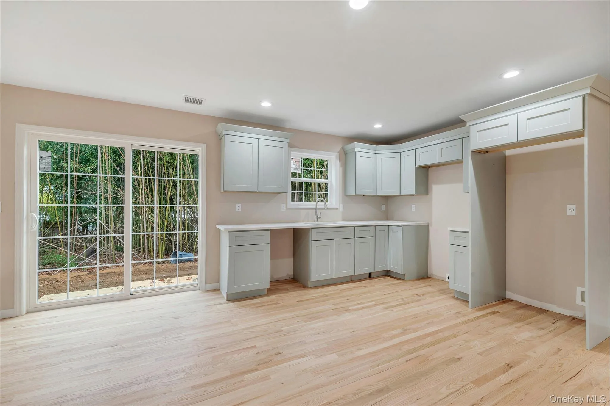 Kitchen featuring light wood finished floors and recessed lighting Kitchen featuring light wood finished floors and recessed lighting