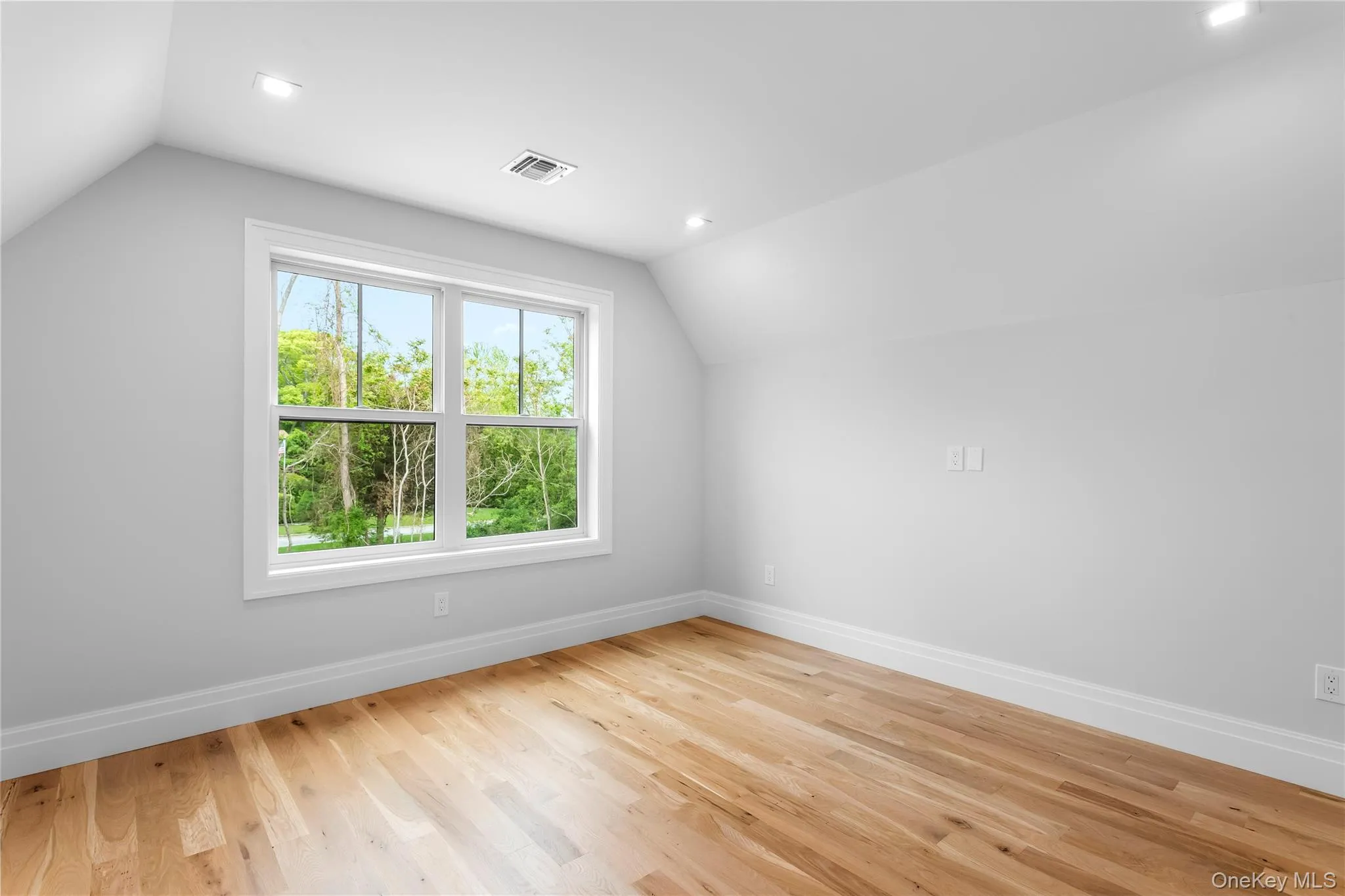 Bonus room with vaulted ceiling, baseboards, light wood-style floors, and recessed lighting Bonus room with vaulted ceiling, baseboards, light wood-style floors, and recessed lighting