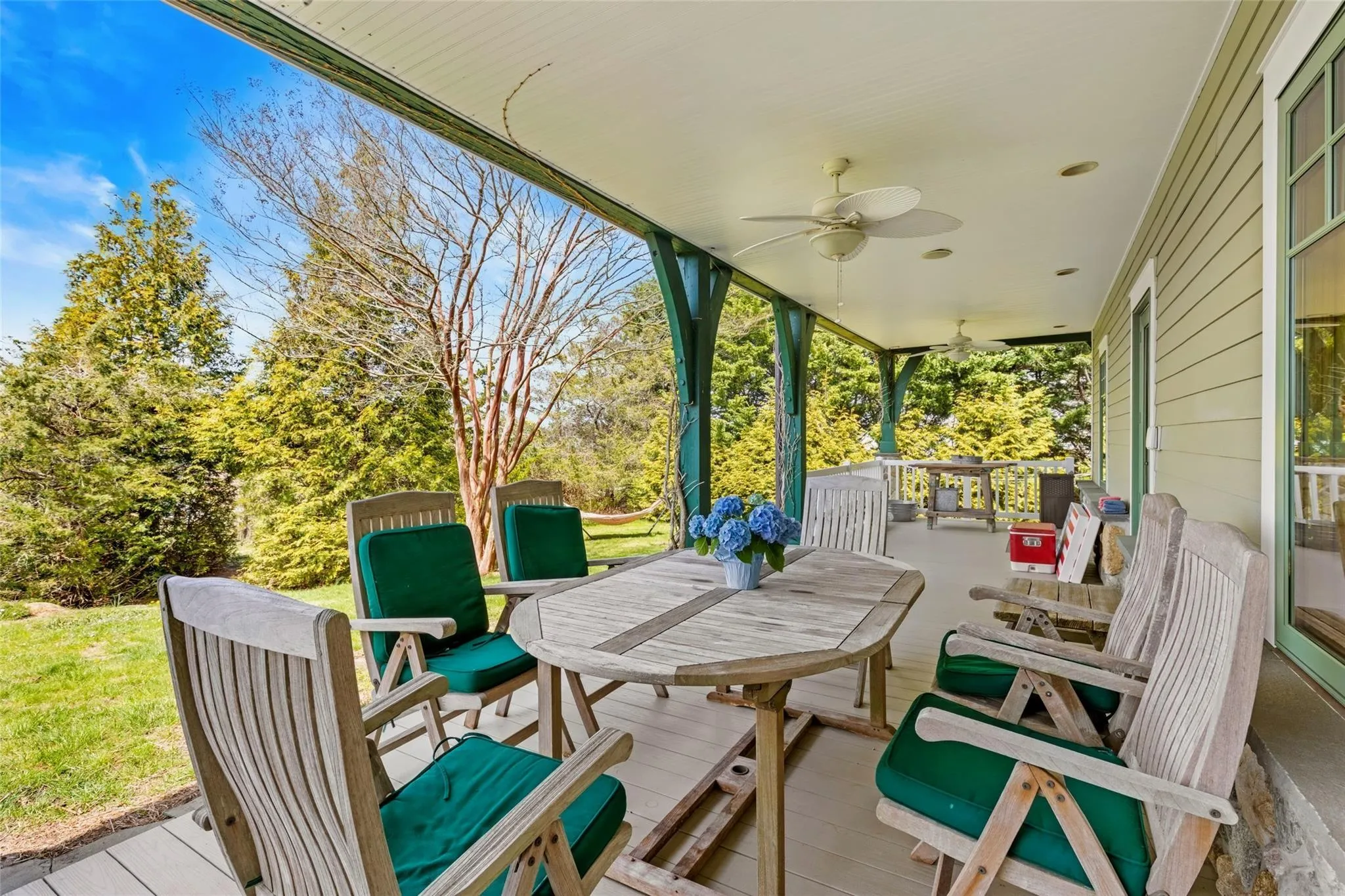 View of patio / terrace featuring outdoor dining area and ceiling fan View of patio / terrace featuring outdoor dining area and ceiling fan