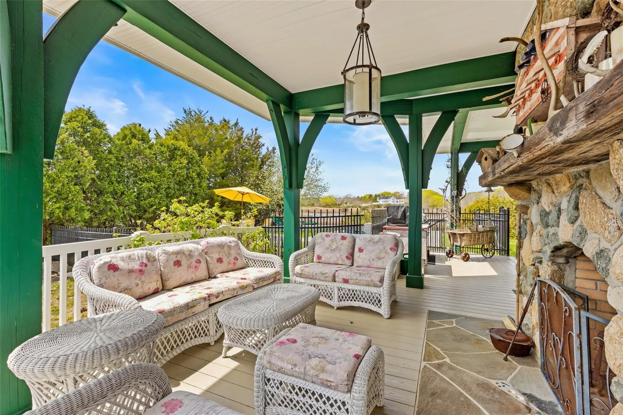 Wooden terrace with fence and an outdoor hangout area Wooden terrace with fence and an outdoor hangout area