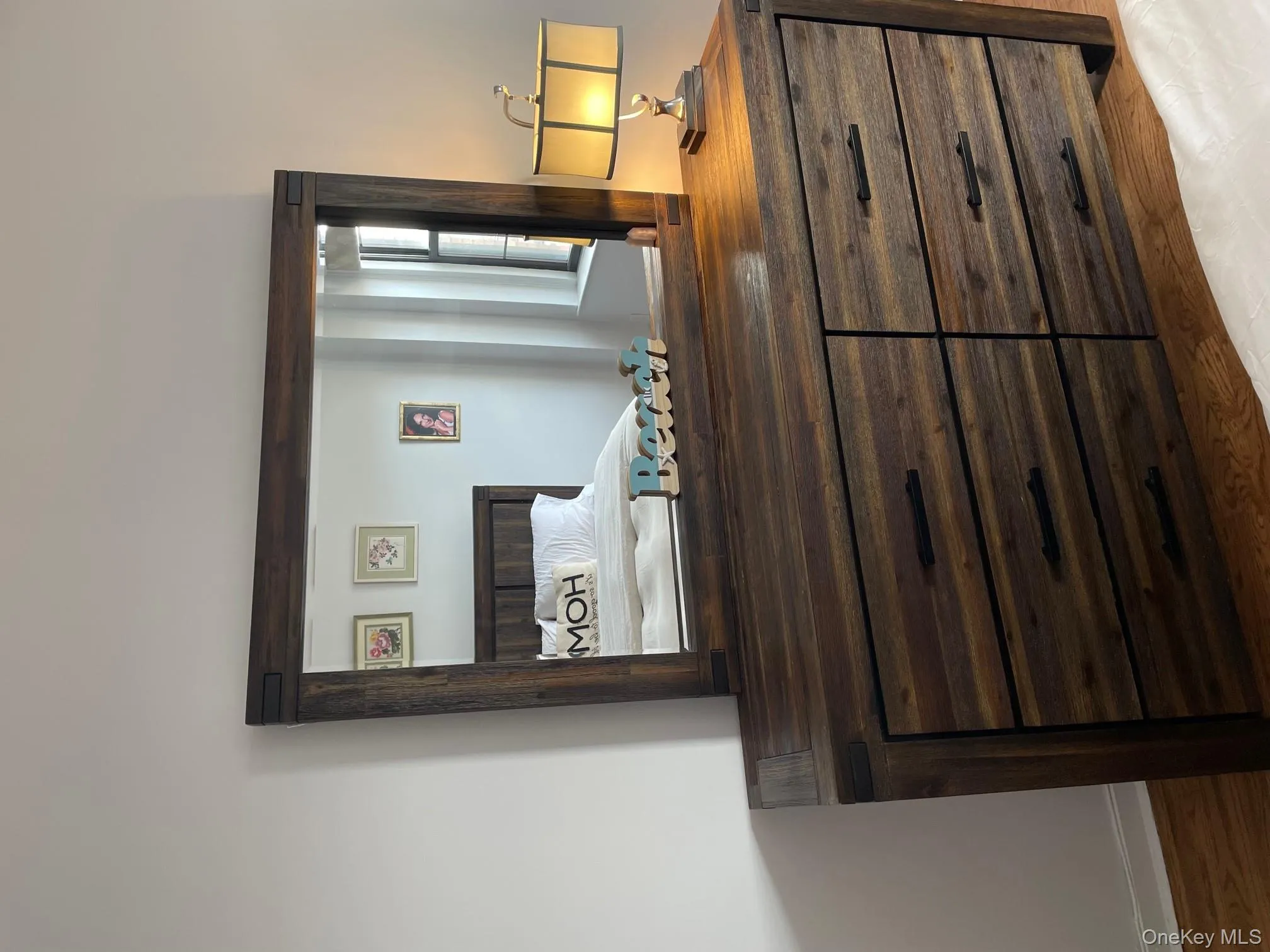 Bedroom with baseboards and wood finished floors Bedroom with baseboards and wood finished floors