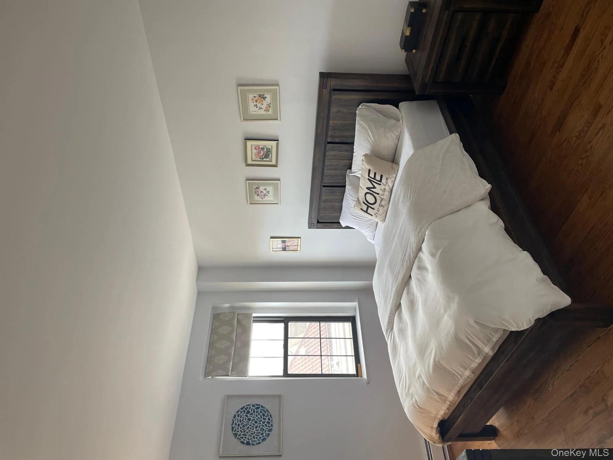 Bedroom featuring wood finished floors Bedroom featuring wood finished floors
