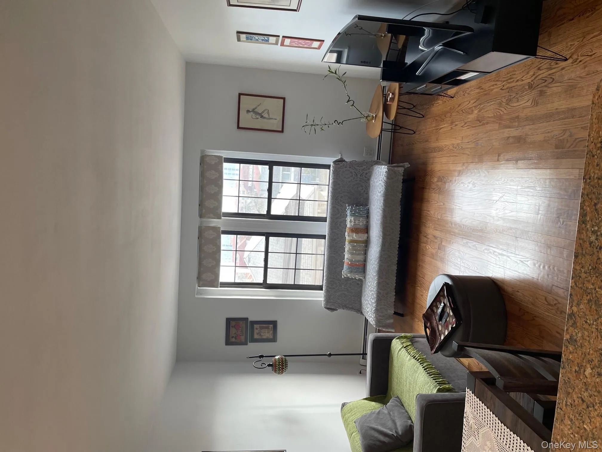 Living area with wood-type flooring Living area with wood-type flooring