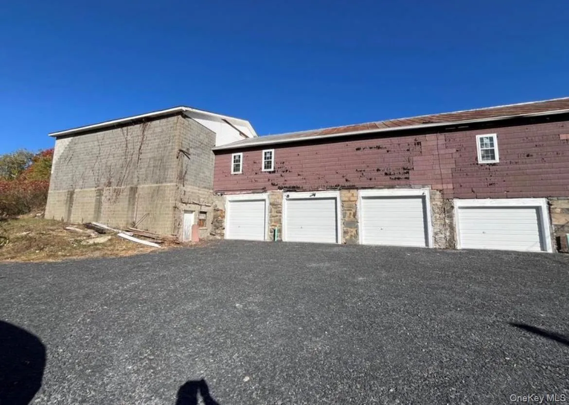 View of property exterior with stone siding View of property exterior with stone siding
