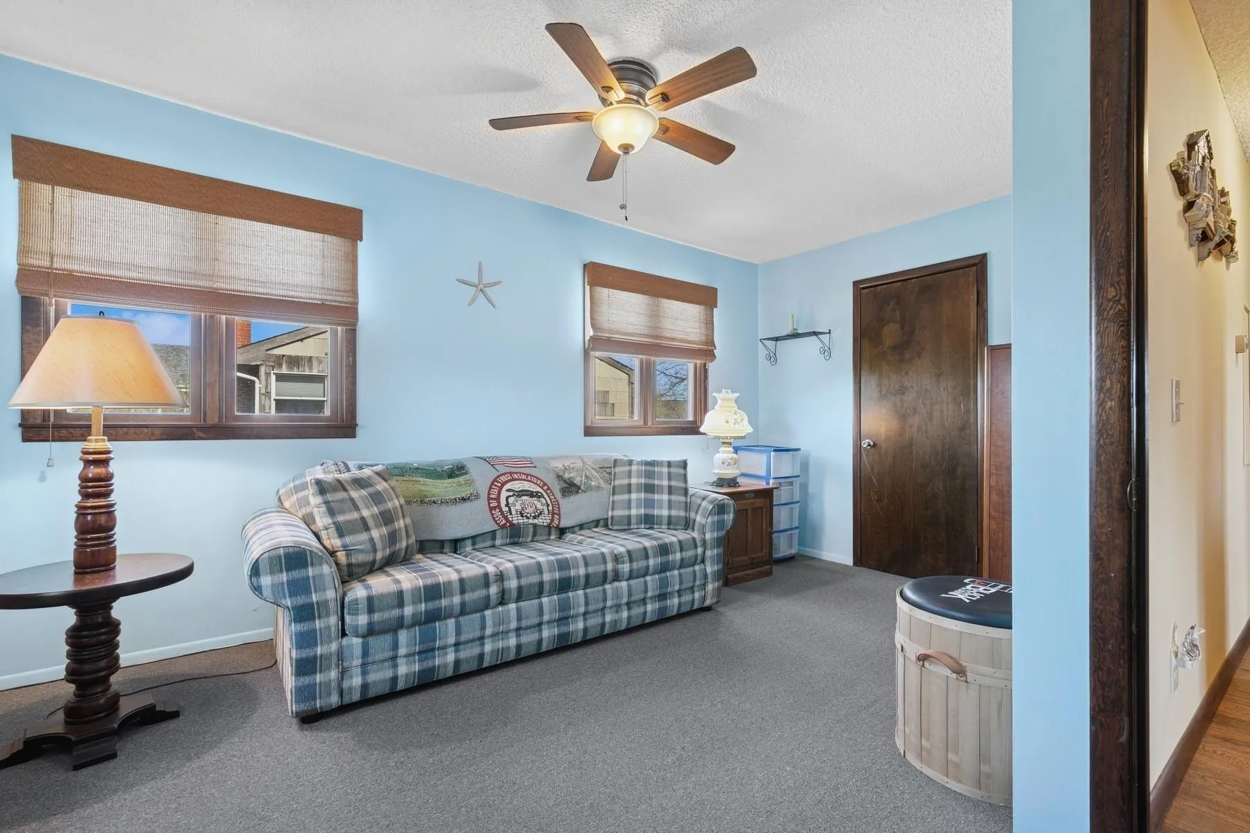 Living room featuring baseboards, carpet flooring, and ceiling fan Living room featuring baseboards, carpet flooring, and ceiling fan