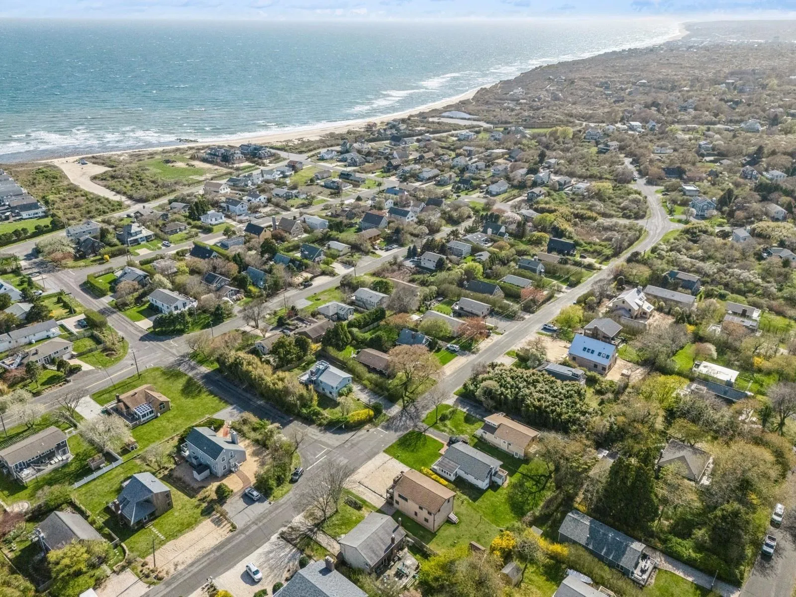 Bird's eye view featuring a water view and a view of the beach Bird's eye view featuring a water view and a view of the beach