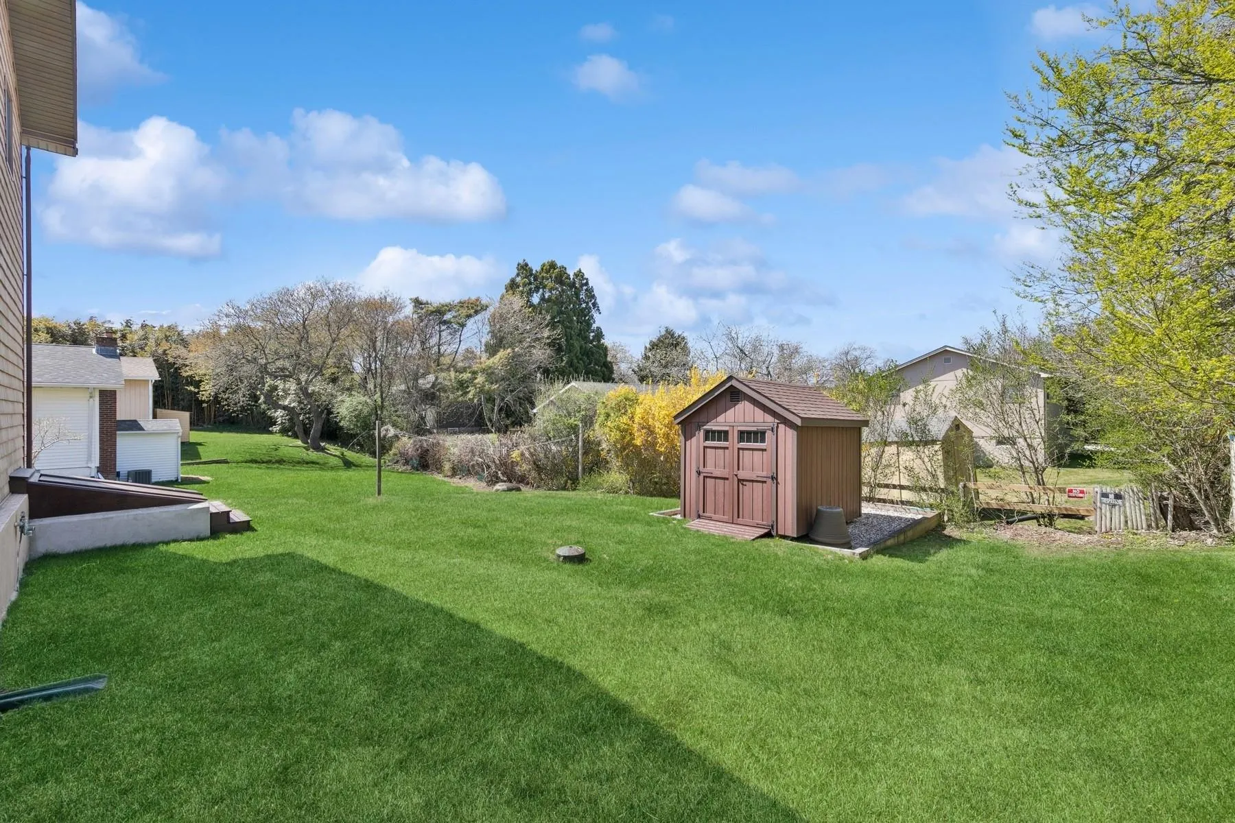 View of yard with a storage shed and an outbuilding View of yard with a storage shed and an outbuilding
