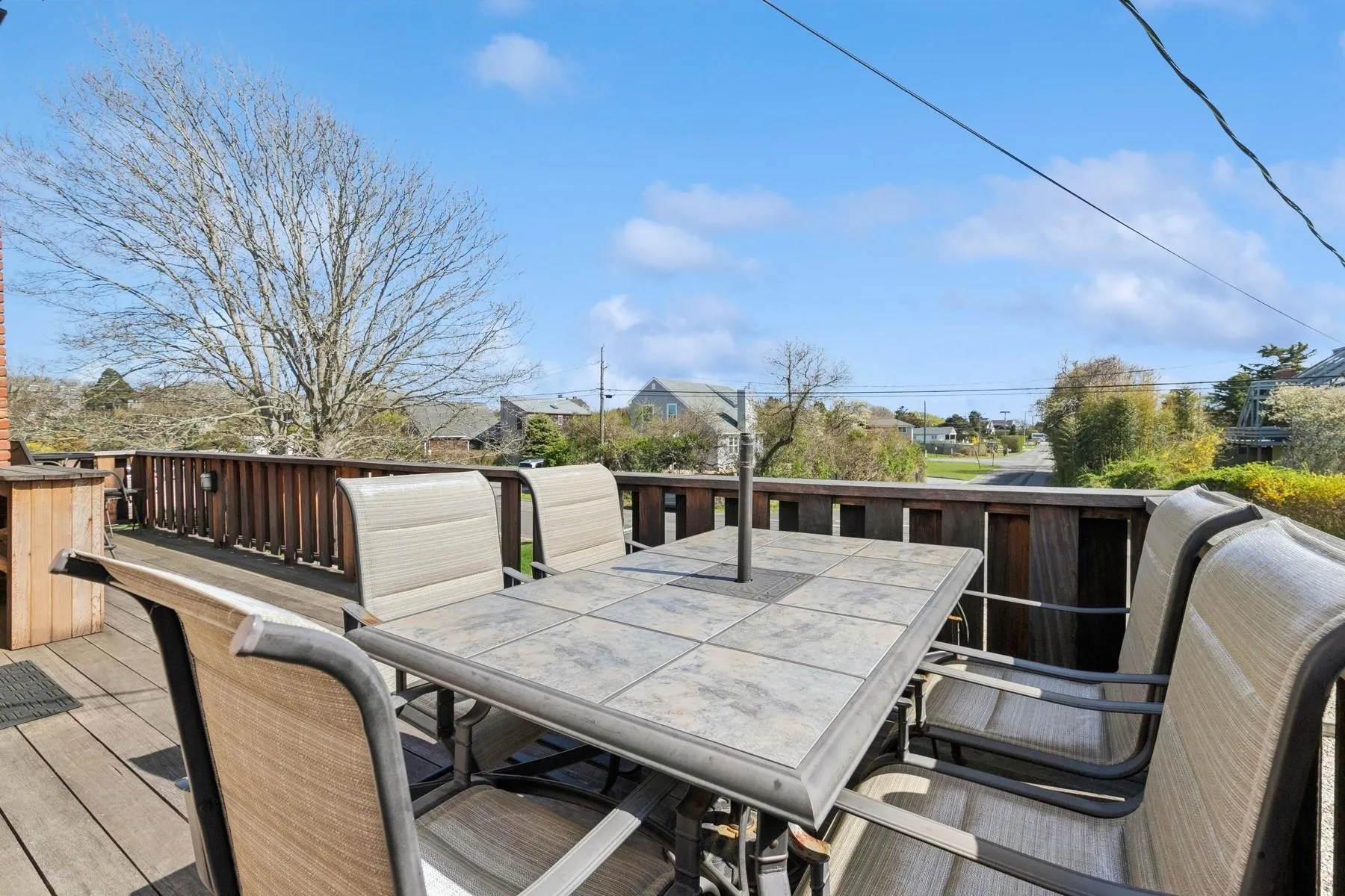Wooden terrace featuring outdoor dining space Wooden terrace featuring outdoor dining space