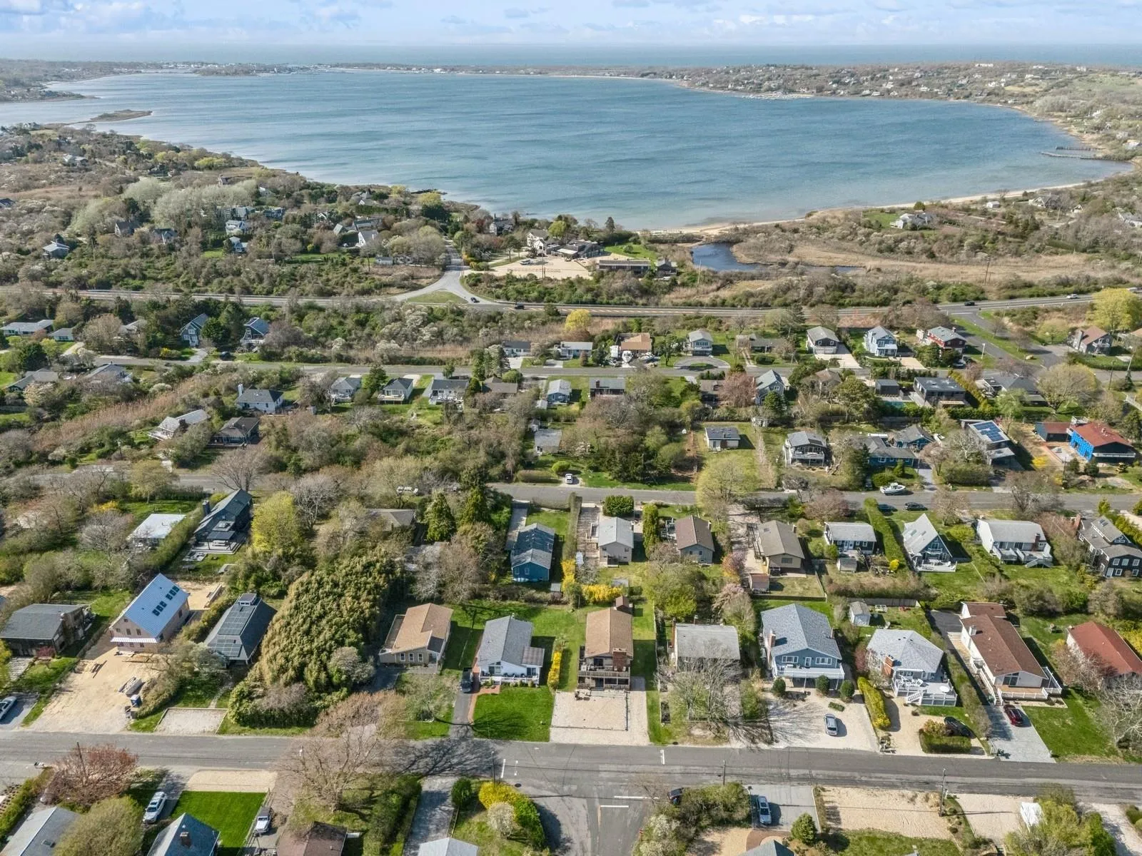 Drone / aerial view with a residential view and a water view Drone / aerial view with a residential view and a water view