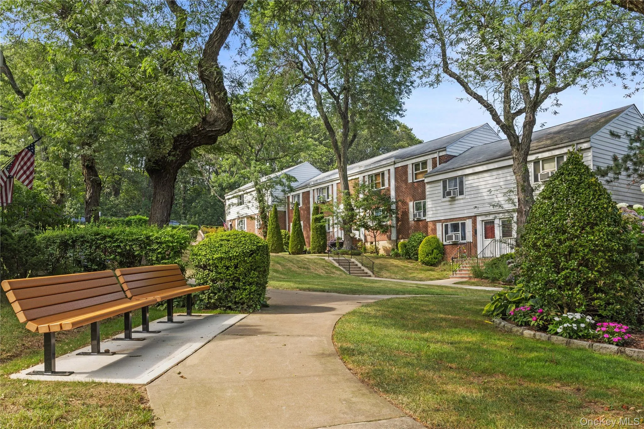 View of property's community with a lawn and a residential view View of property's community with a lawn and a residential view