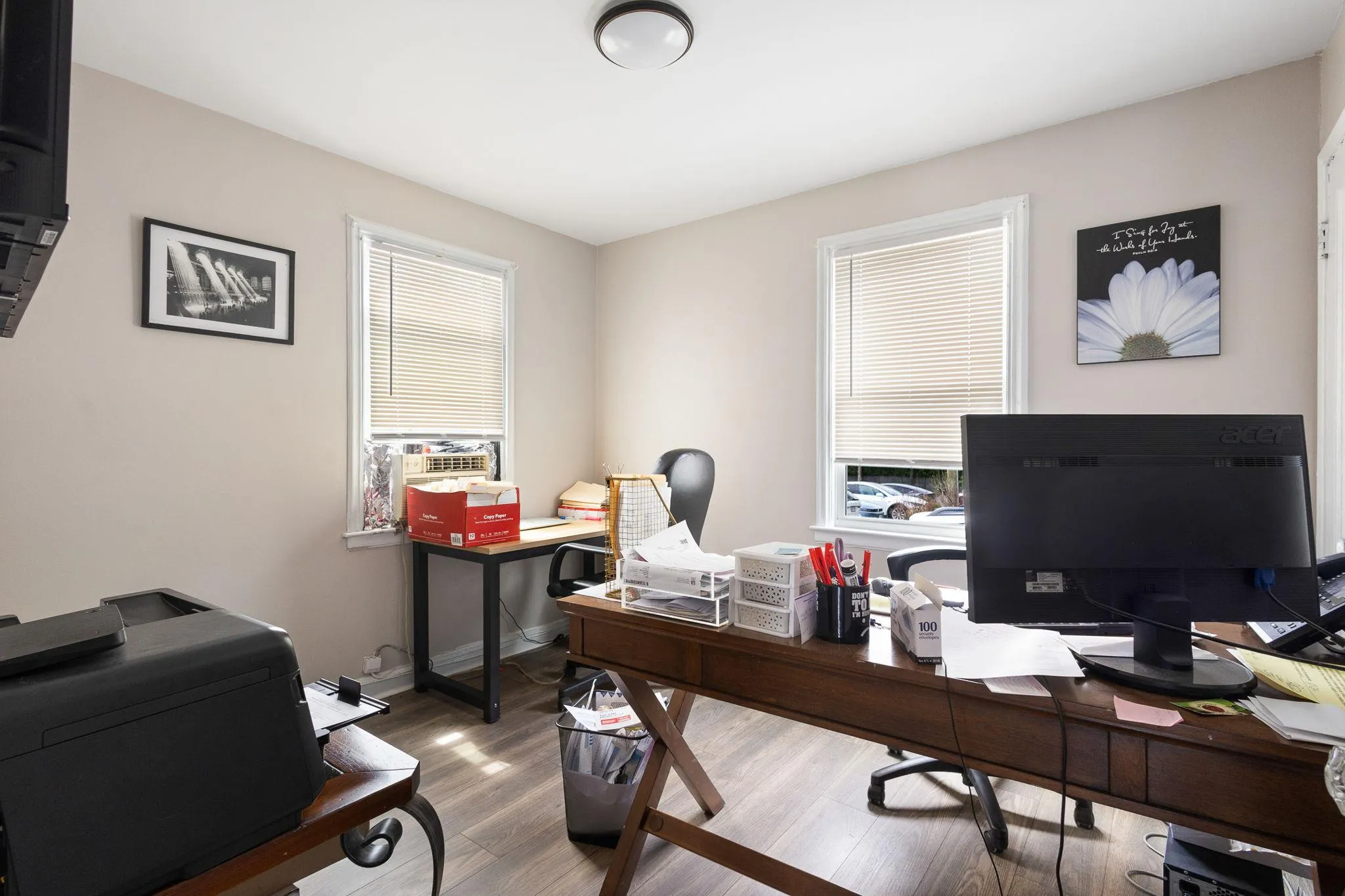 Office featuring baseboards, wood finished floors, and cooling unit Office featuring baseboards, wood finished floors, and cooling unit
