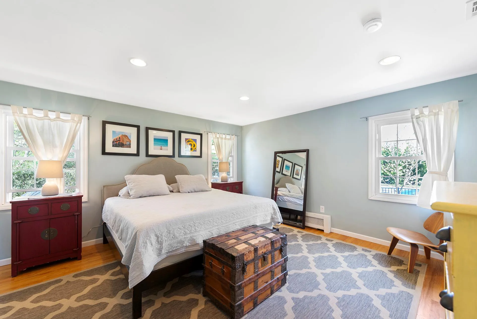 Bedroom featuring wood finished floors, baseboards, and recessed lighting Bedroom featuring wood finished floors, baseboards, and recessed lighting