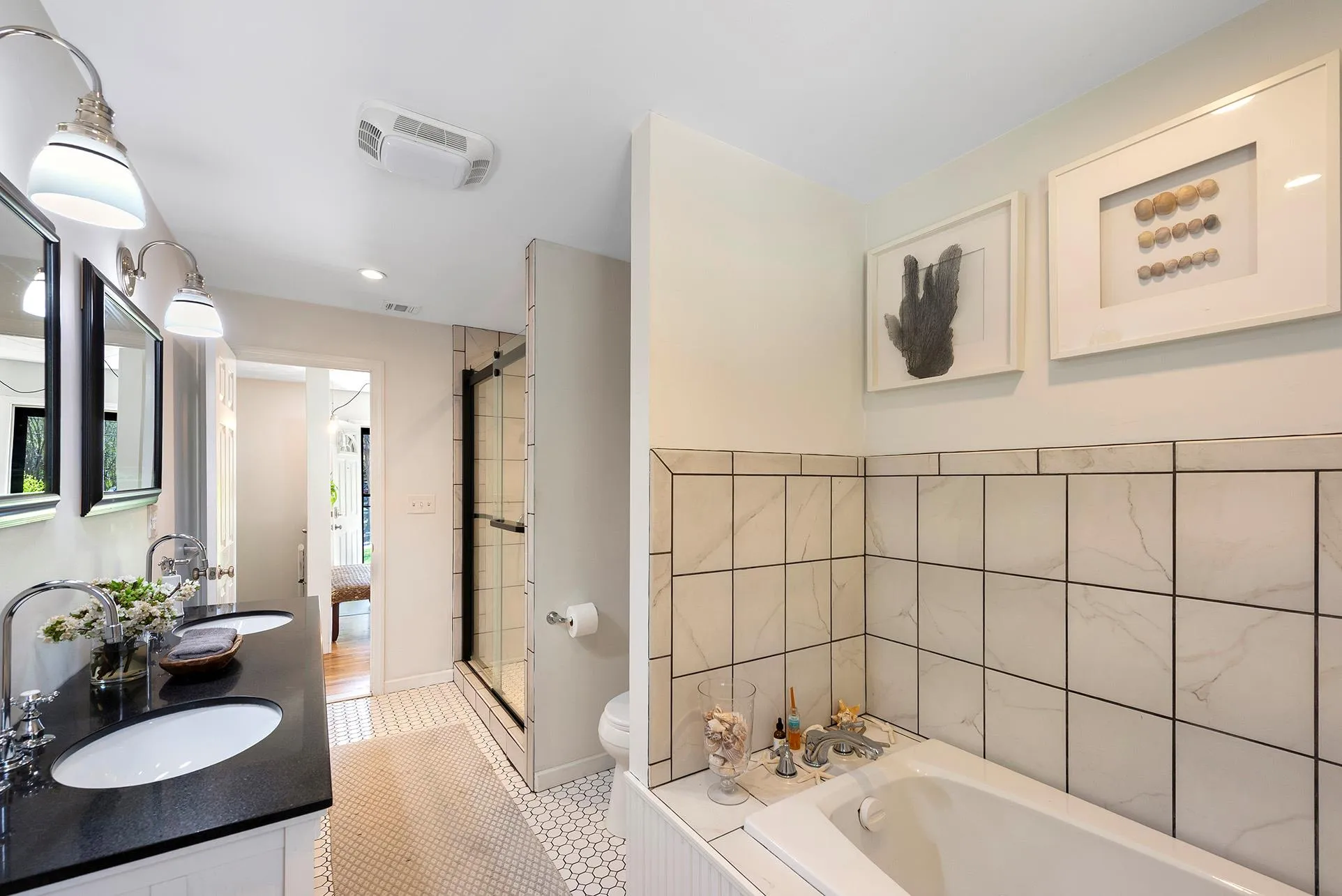 Full bath with toilet, a shower stall, a bath, tile patterned floors, and double vanity Full bath with toilet, a shower stall, a bath, tile patterned floors, and double vanity