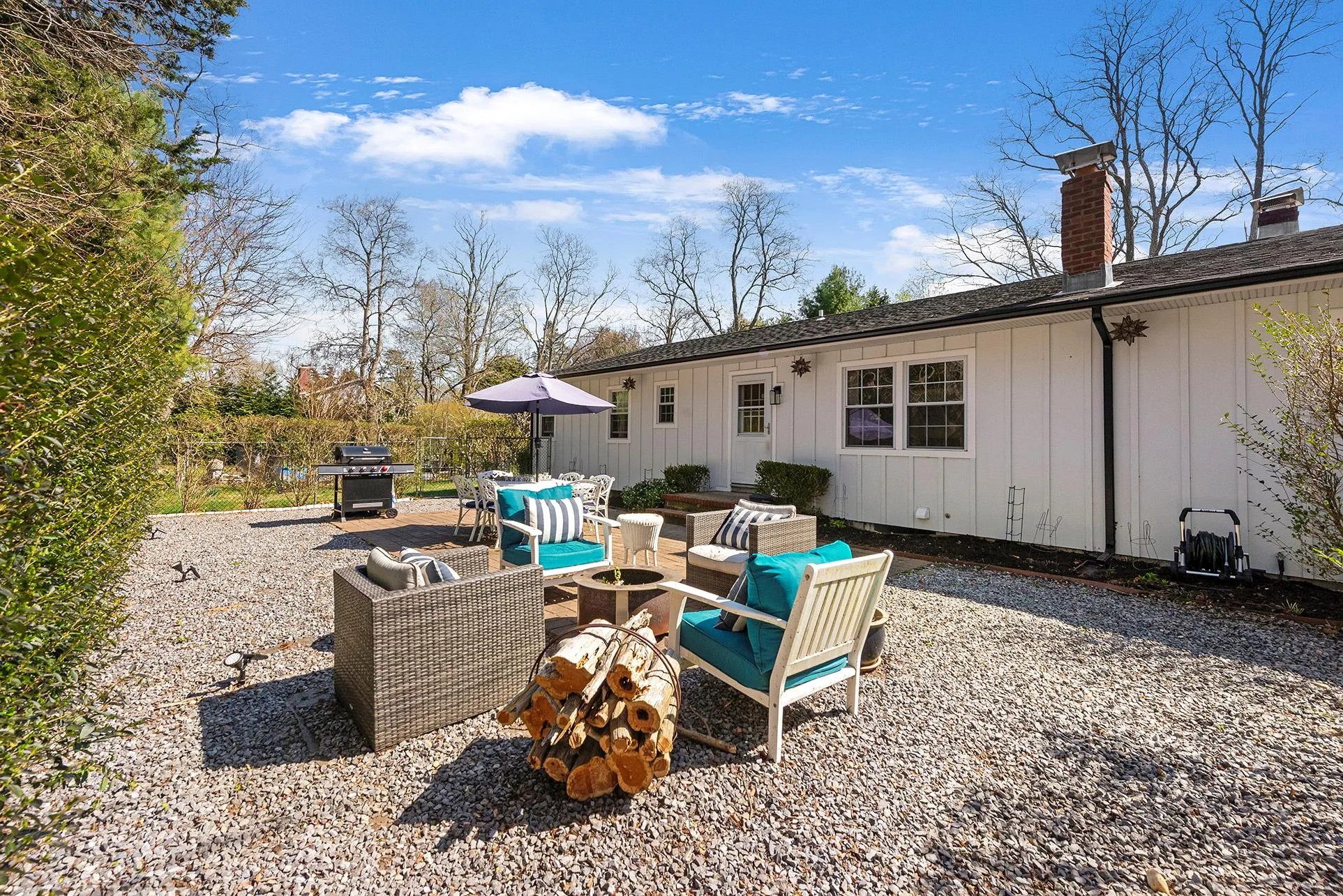 Back of property with board and batten siding, a chimney, roof with shingles, outdoor lounge area, and outdoor dining area Back of property with board and batten siding, a chimney, roof with shingles, outdoor lounge area, and outdoor dining area
