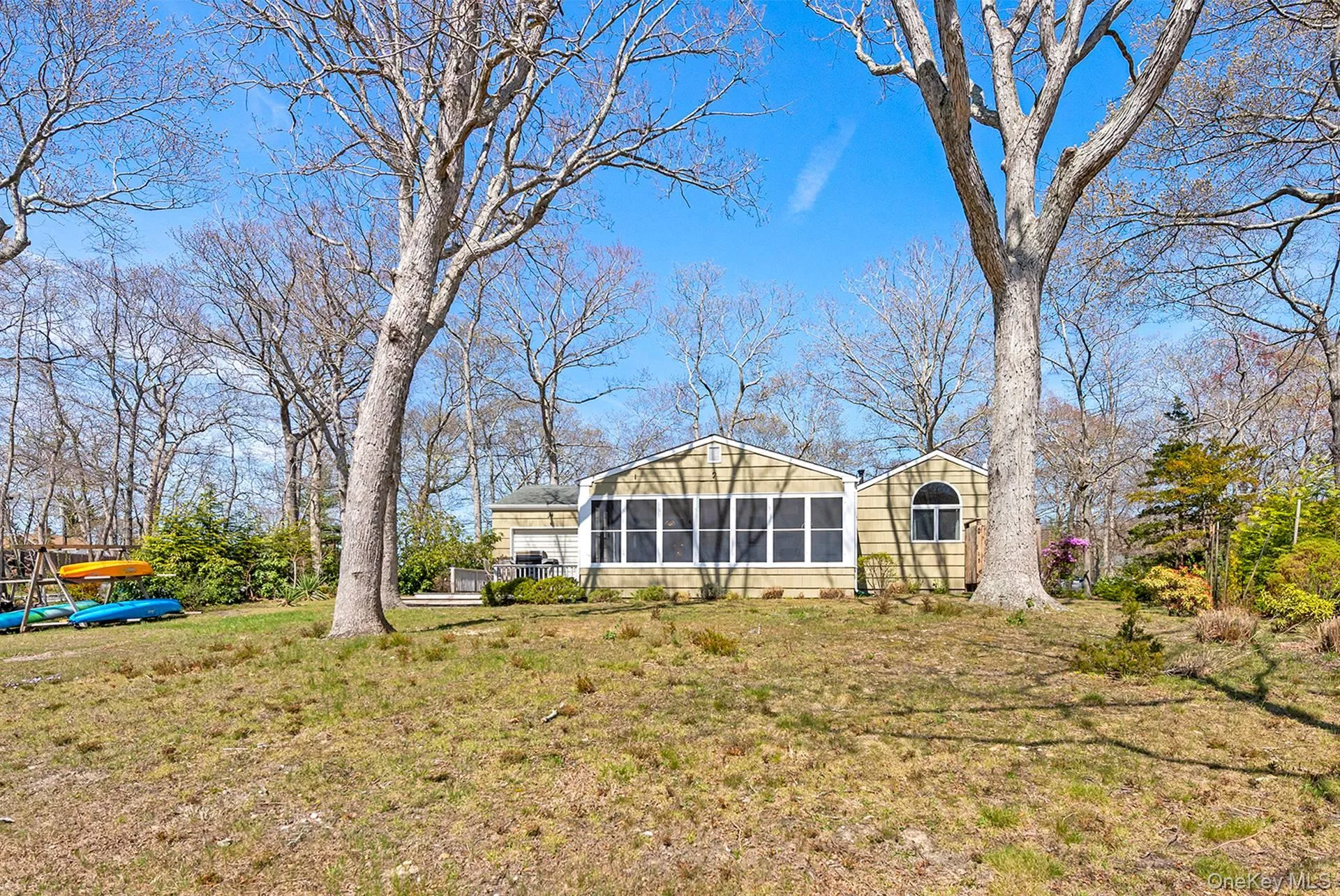 View of yard featuring a sunroom View of yard featuring a sunroom
