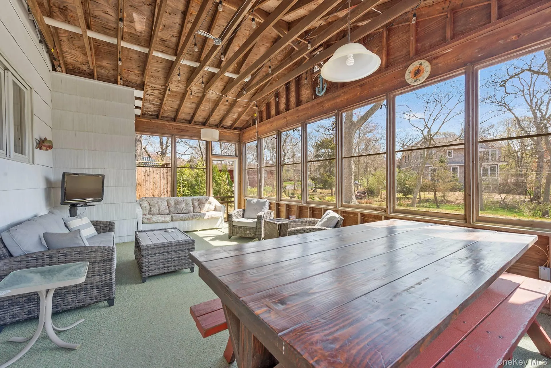 Sunroom with an outdoor hangout area Sunroom with an outdoor hangout area