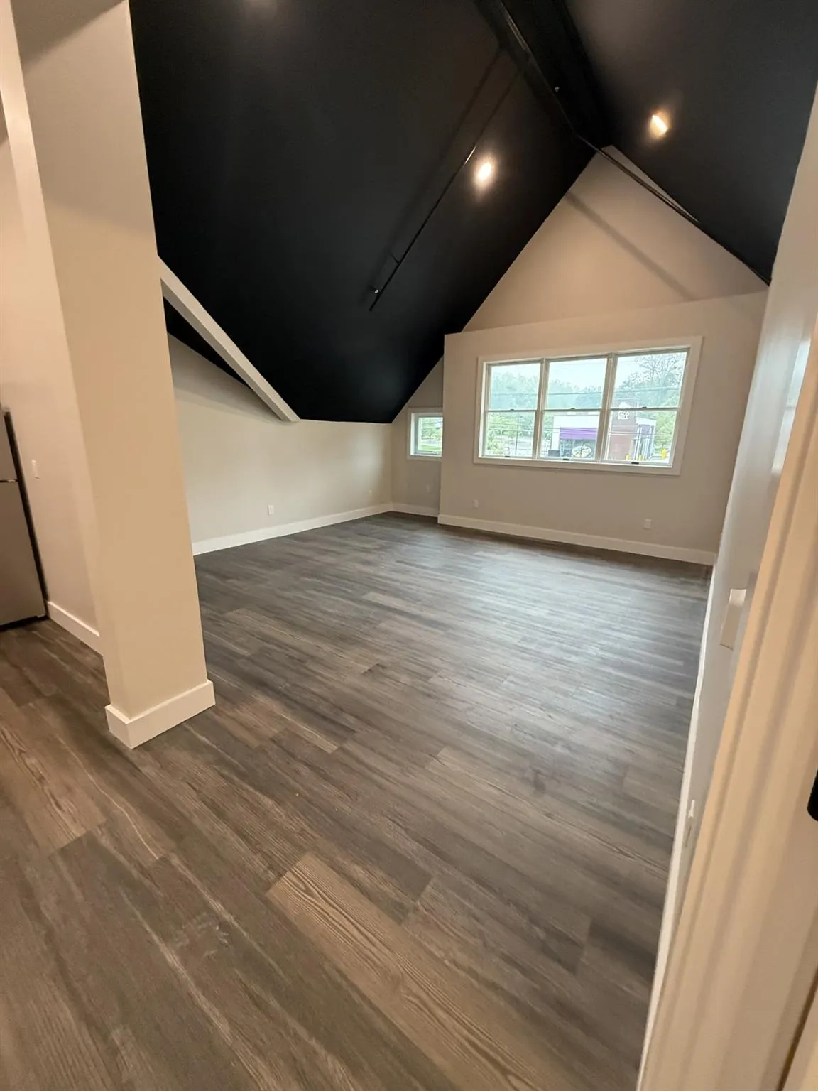 Bonus room with baseboards, dark wood-type flooring, and recessed lighting Bonus room with baseboards, dark wood-type flooring, and recessed lighting