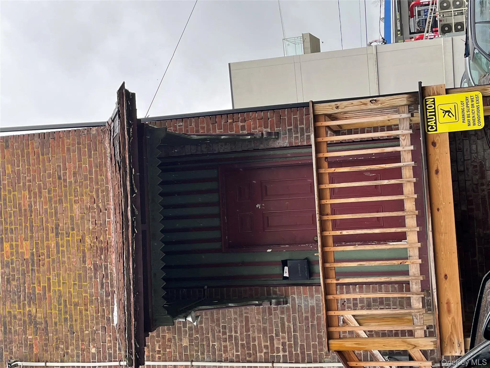 Doorway to property with brick siding Doorway to property with brick siding