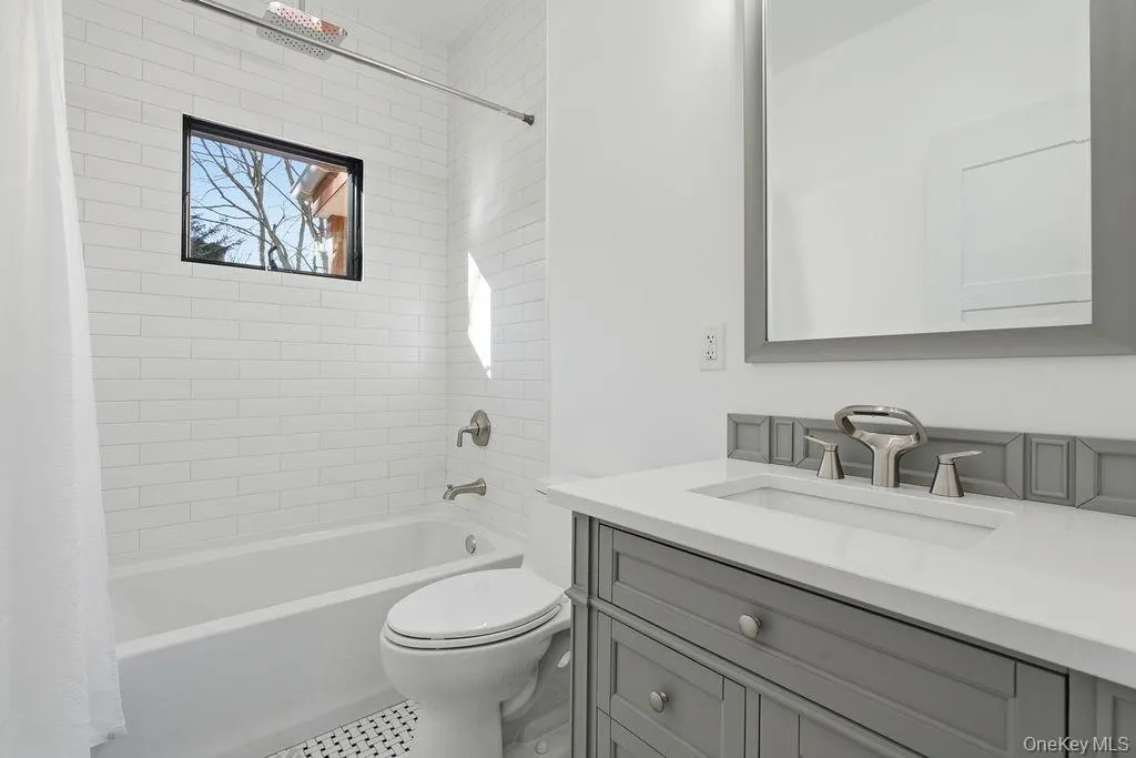 Full bath with shower / bath combo and vanity Full bath with shower / bath combo and vanity