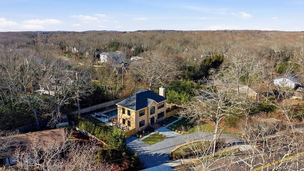 View from above of property featuring a heavily wooded area View from above of property featuring a heavily wooded area