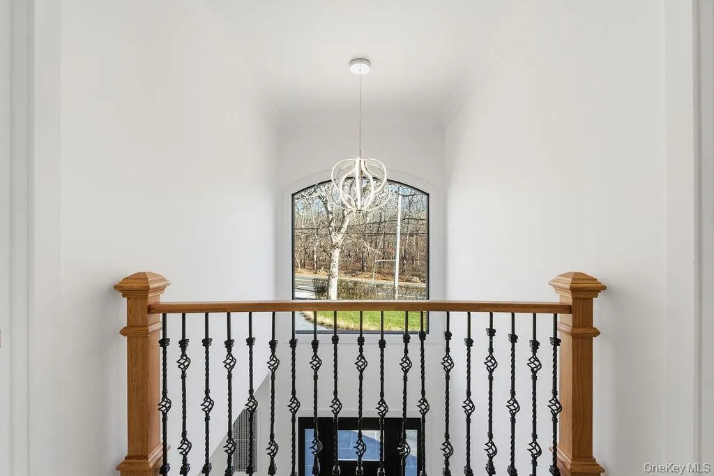 Detailed view of crown molding and a chandelier Detailed view of crown molding and a chandelier