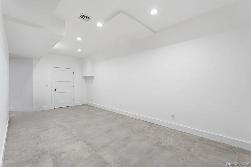 Spare room with recessed lighting and concrete floors Spare room with recessed lighting and concrete floors
