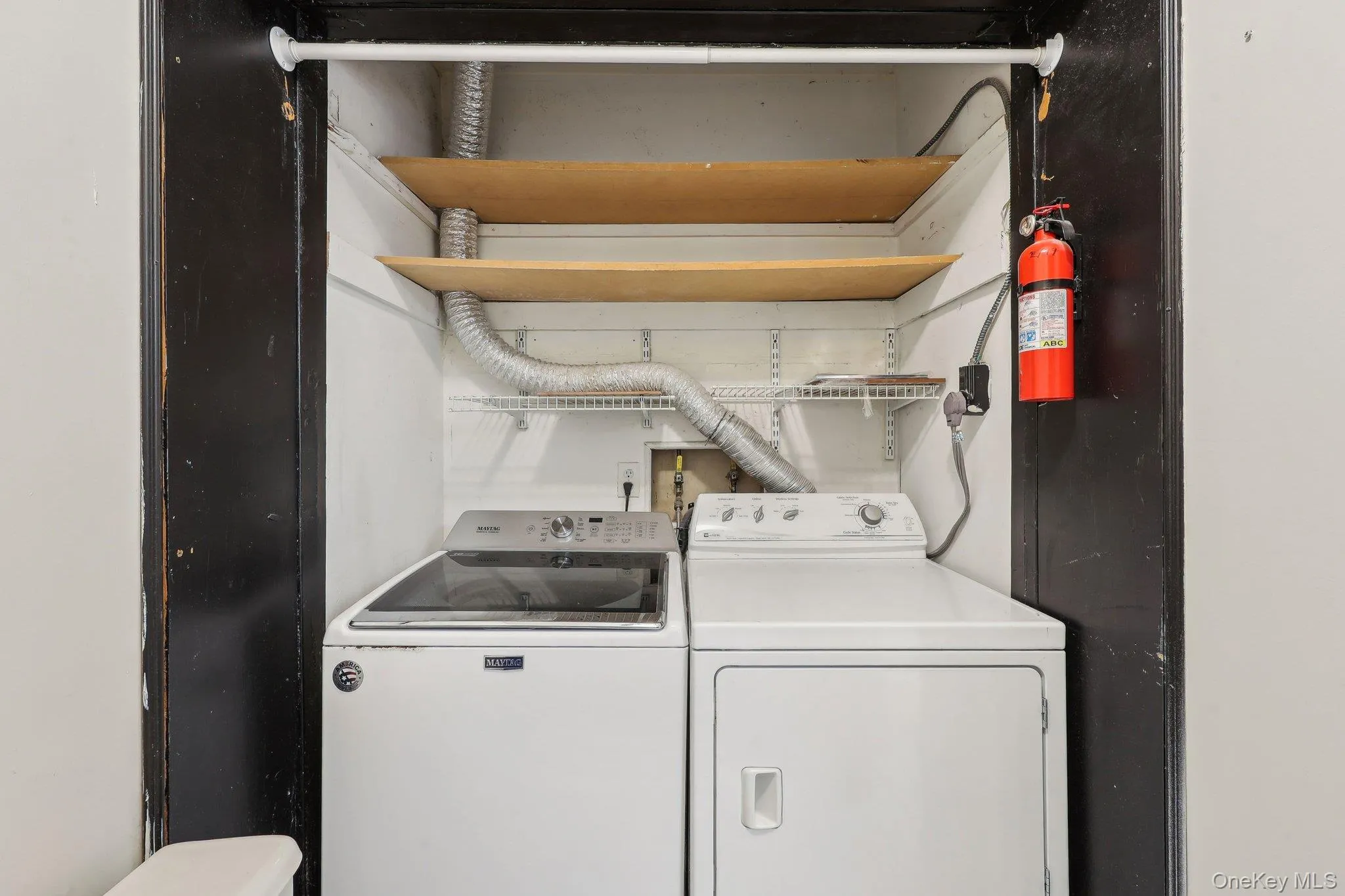Laundry area featuring washer and clothes dryer Laundry area featuring washer and clothes dryer