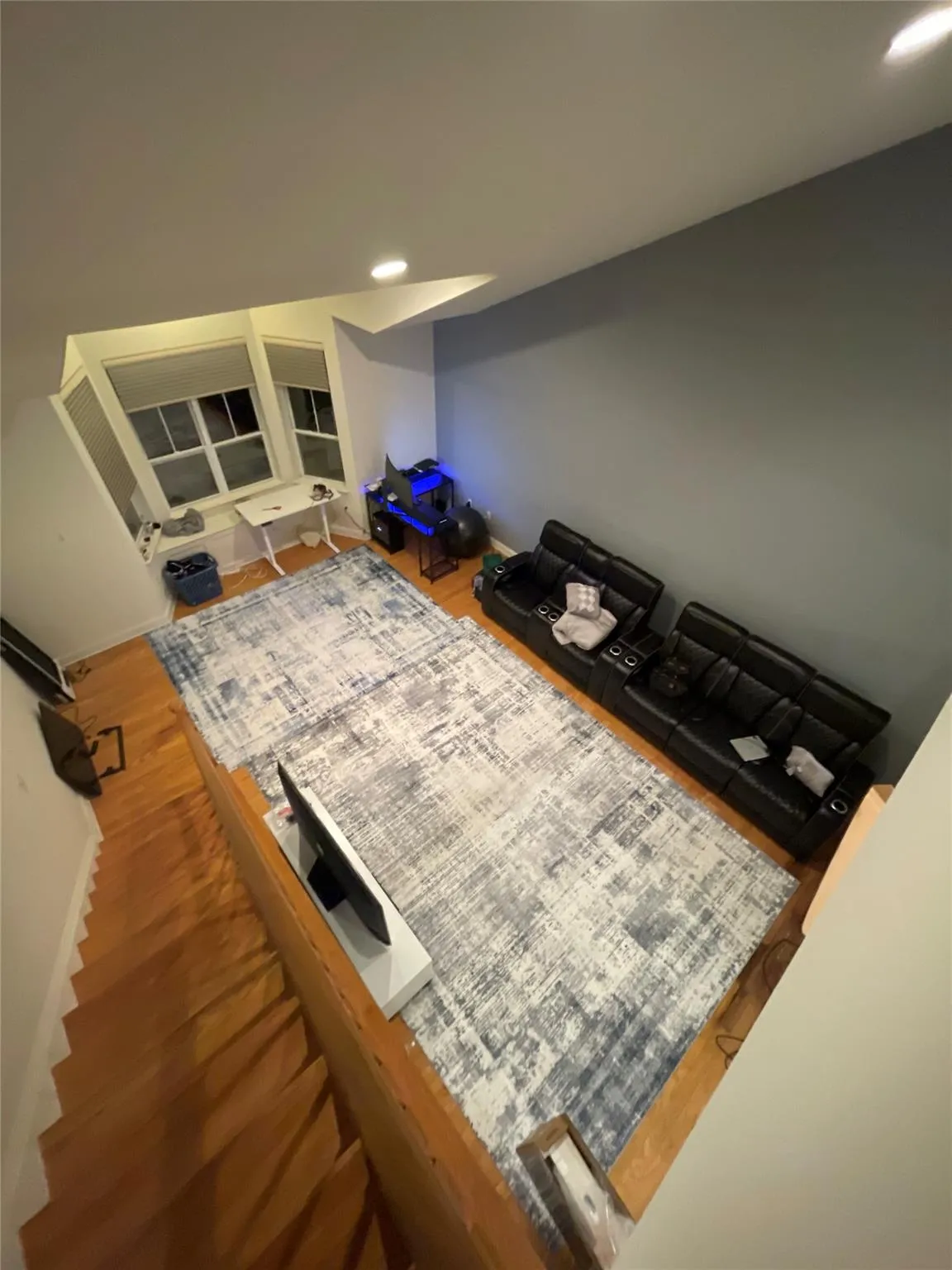 Living room with recessed lighting and wood finished floors Living room with recessed lighting and wood finished floors