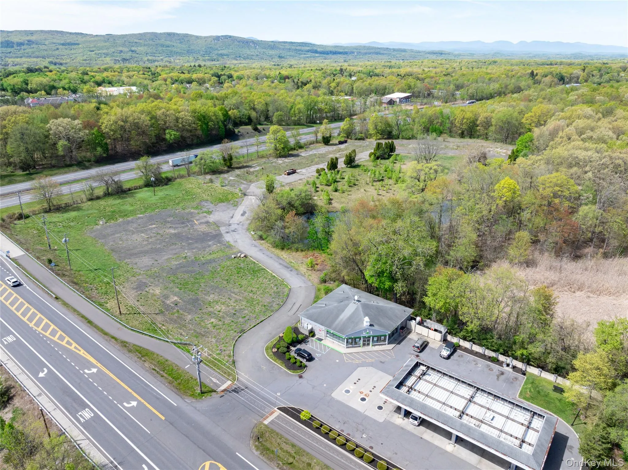 Birds eye view of property featuring a view of trees Birds eye view of property featuring a view of trees