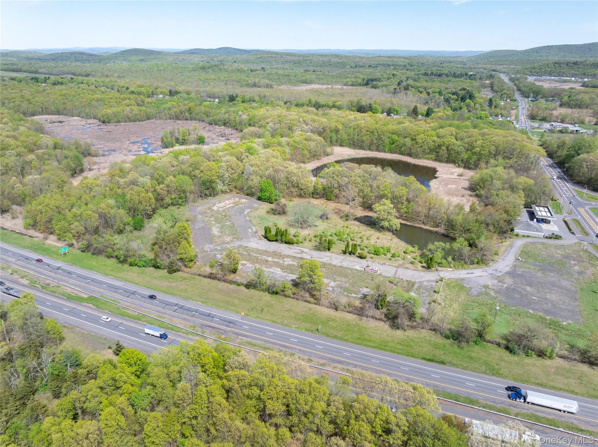 Birds eye view of property featuring a view of trees Birds eye view of property featuring a view of trees