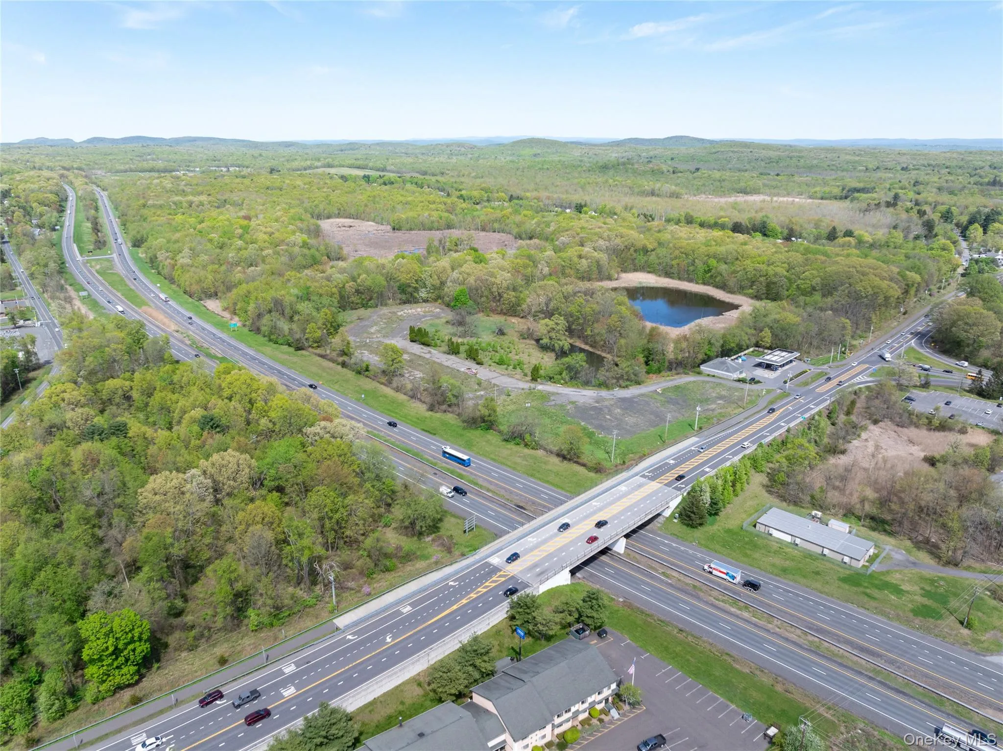 Drone / aerial view featuring a water view and a wooded view Drone / aerial view featuring a water view and a wooded view