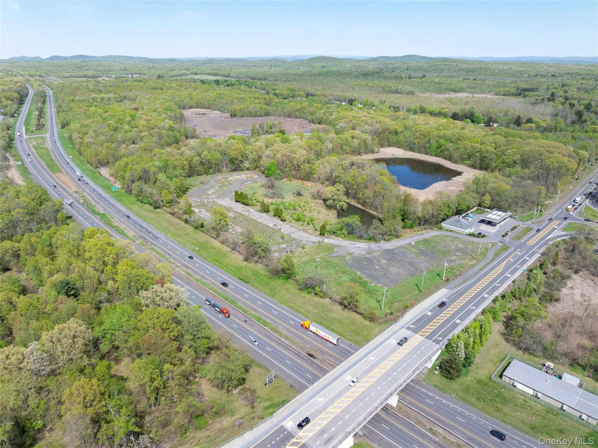 Aerial view with a water view and a view of trees Aerial view with a water view and a view of trees