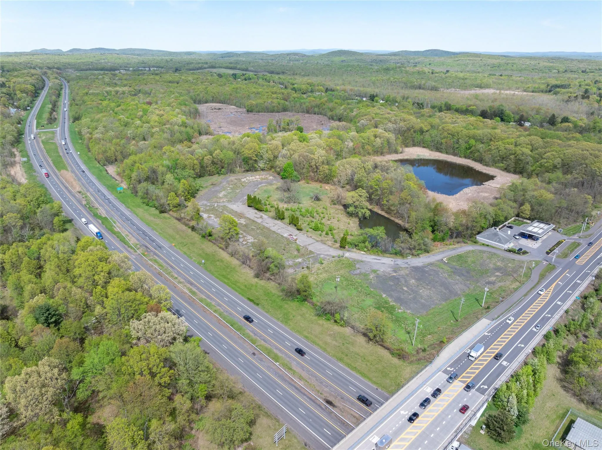 Drone / aerial view featuring a water view and a view of trees Drone / aerial view featuring a water view and a view of trees