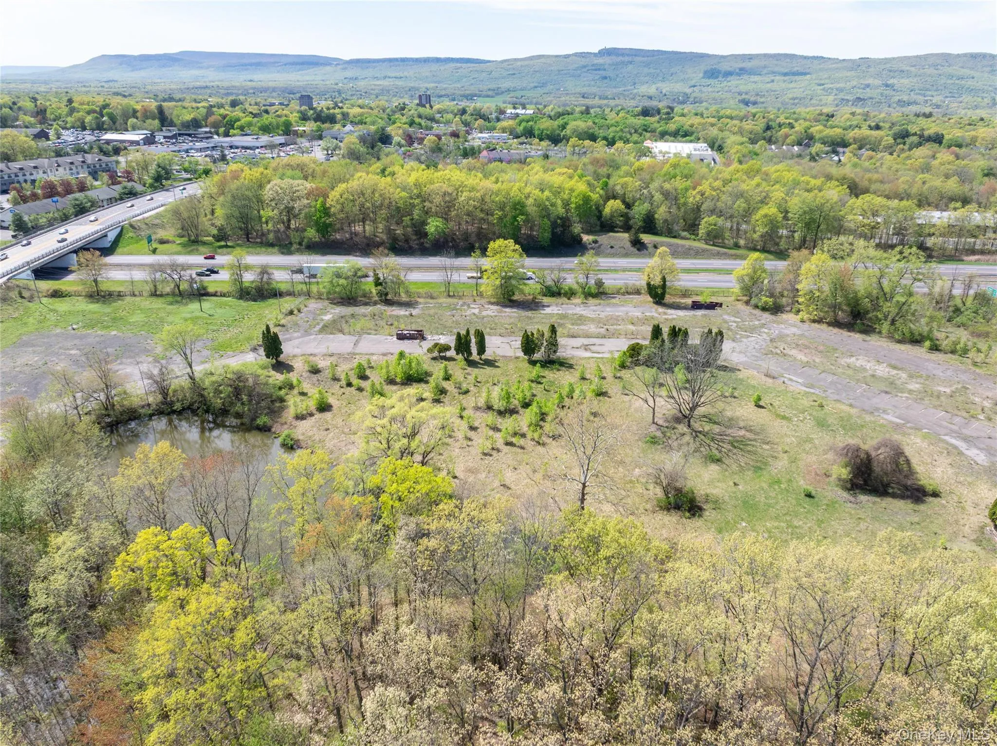 Drone / aerial view featuring a mountain view Drone / aerial view featuring a mountain view