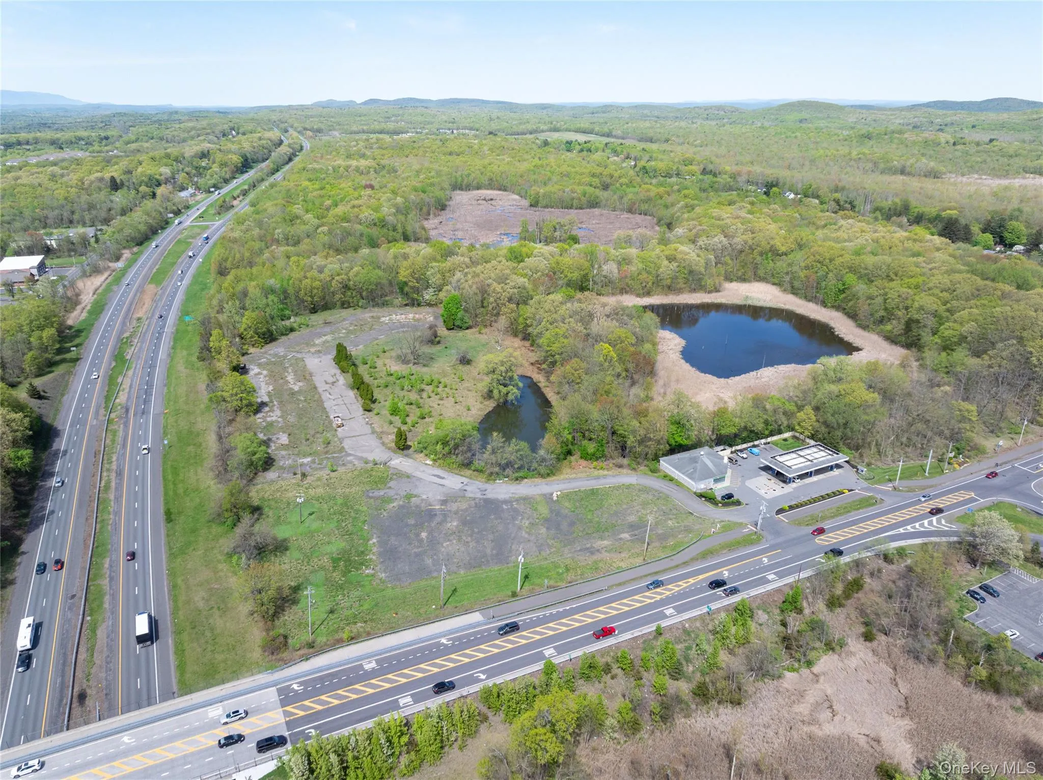 Aerial view with a water view and a forest view Aerial view with a water view and a forest view