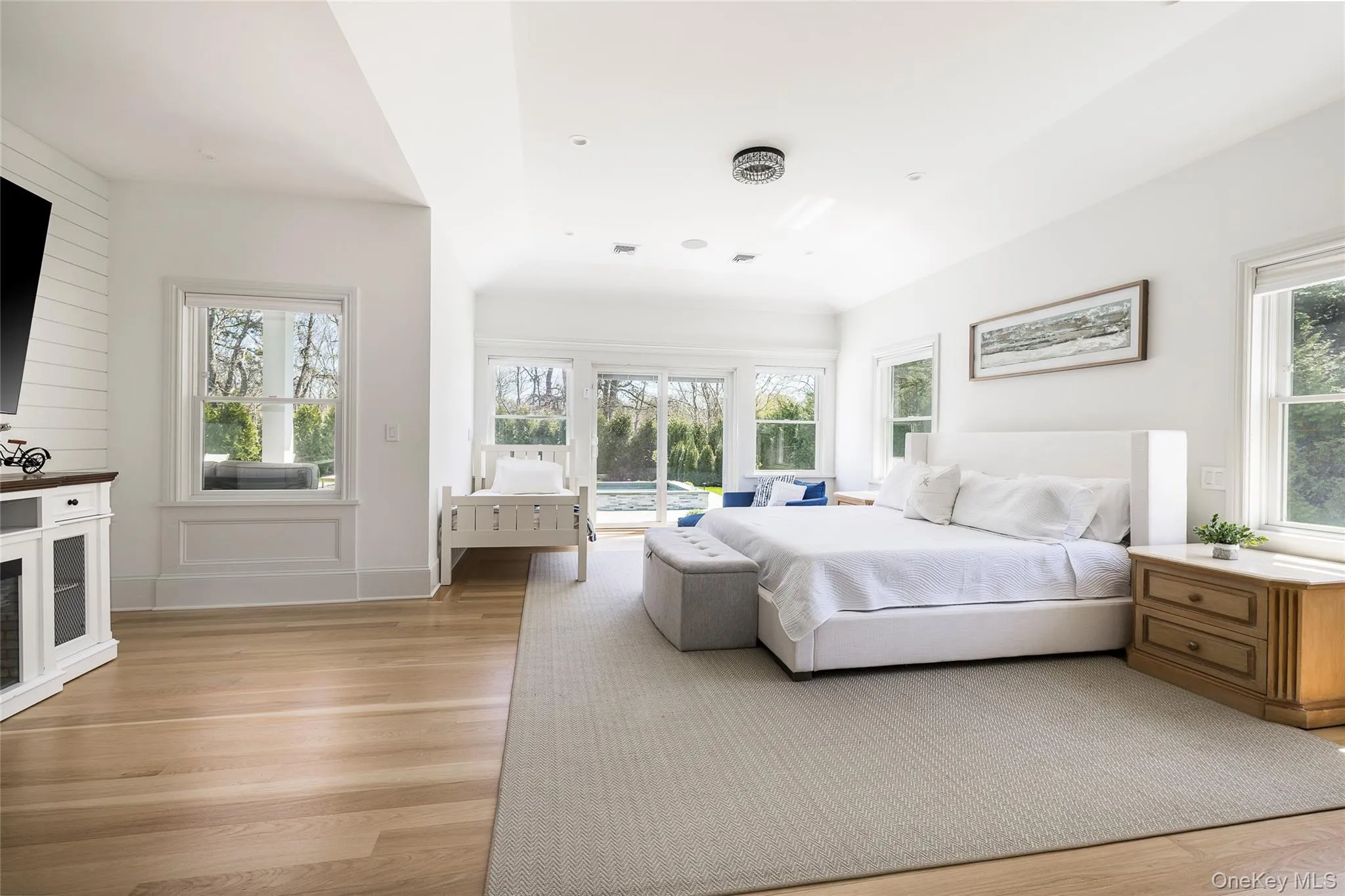Bedroom featuring access to exterior and light wood-style flooring Bedroom featuring access to exterior and light wood-style flooring