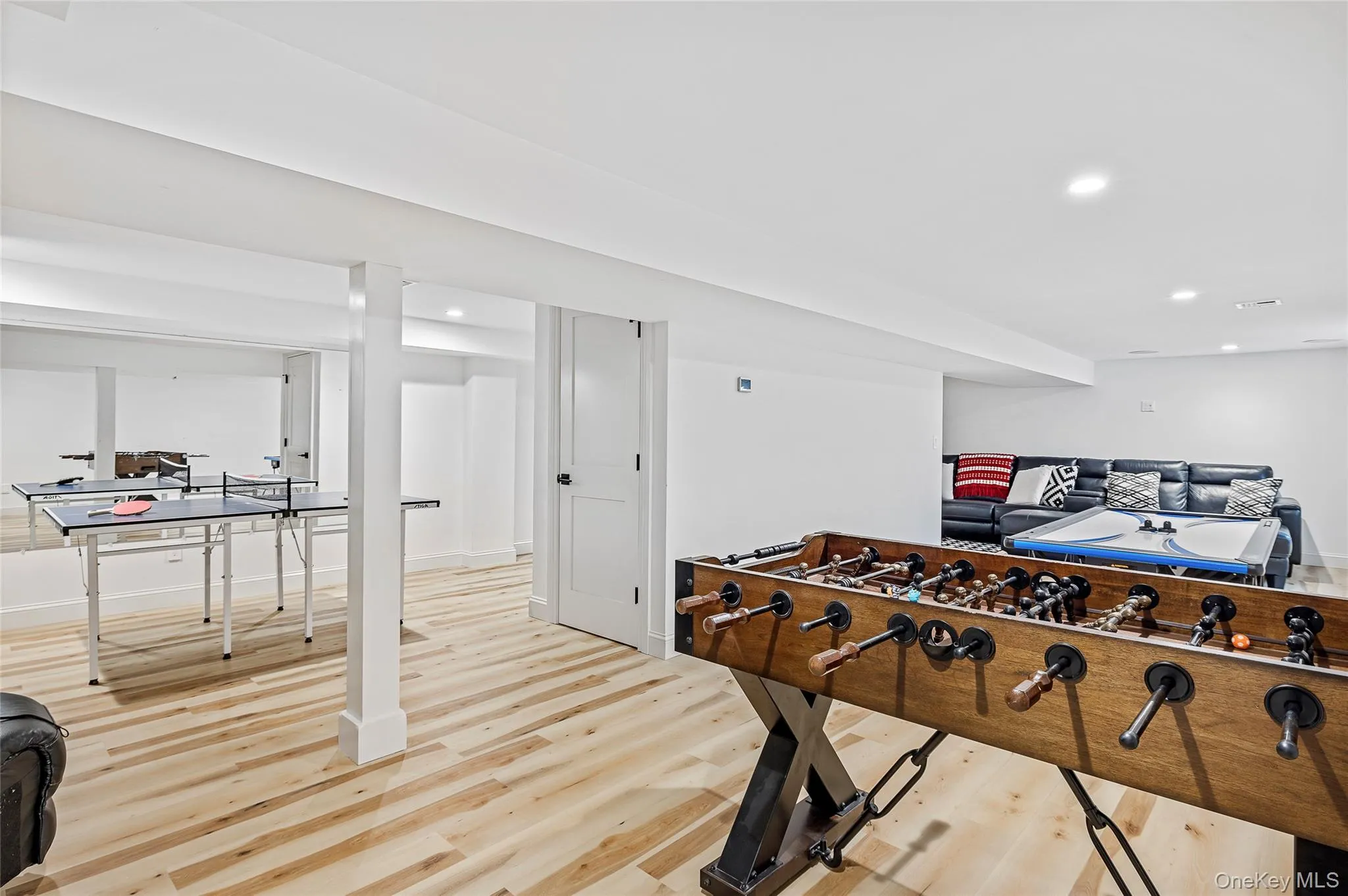 Game room featuring recessed lighting, baseboards, and light wood-style flooring Game room featuring recessed lighting, baseboards, and light wood-style flooring