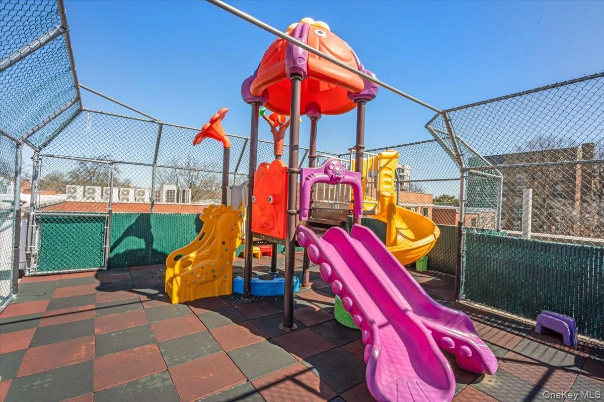 Community playground featuring fence Community playground featuring fence