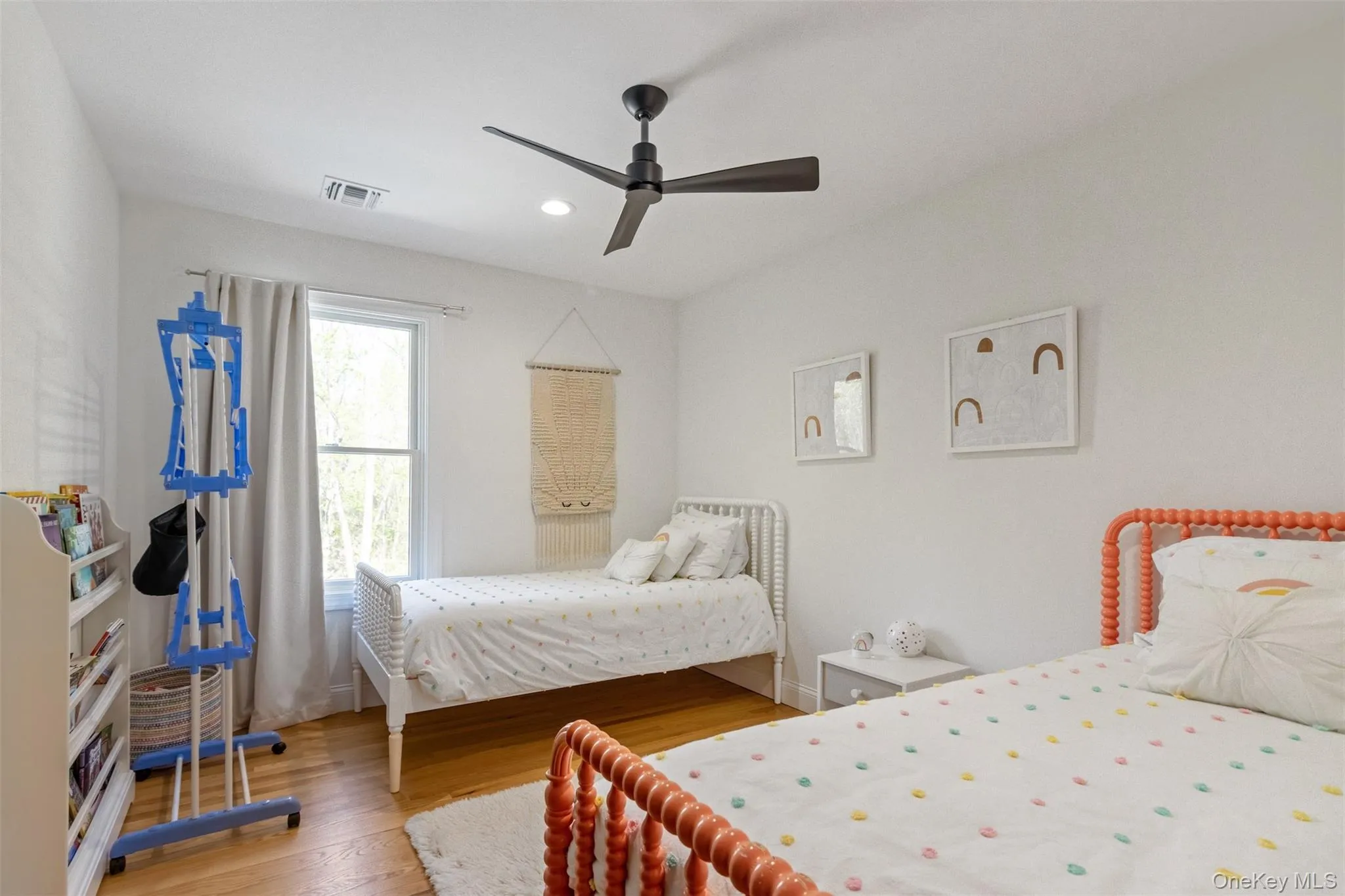 Bedroom featuring ceiling fan, visible vents, baseboards, light wood finished floors, and recessed lighting Bedroom featuring ceiling fan, visible vents, baseboards, light wood finished floors, and recessed lighting
