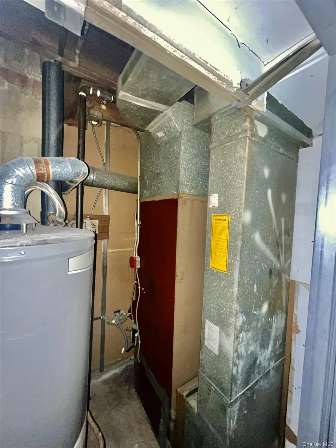 Utilities featuring water heater Utilities featuring water heater