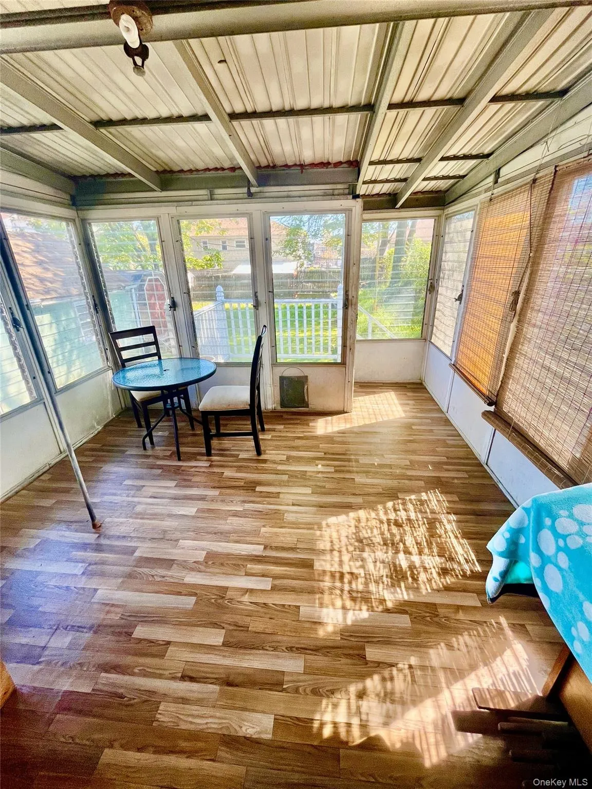 Sunroom / solarium with wood finished floors Sunroom / solarium with wood finished floors
