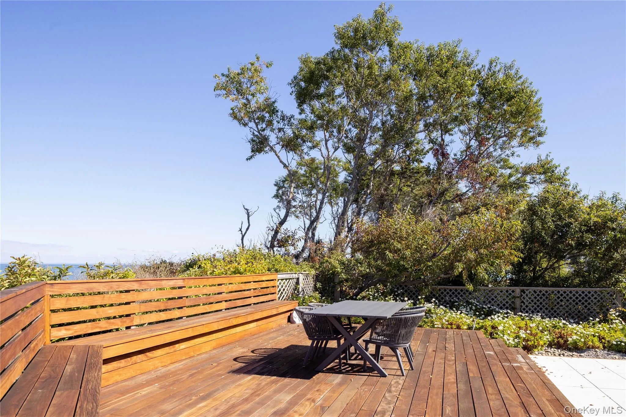 Wooden terrace with outdoor dining area Wooden terrace with outdoor dining area