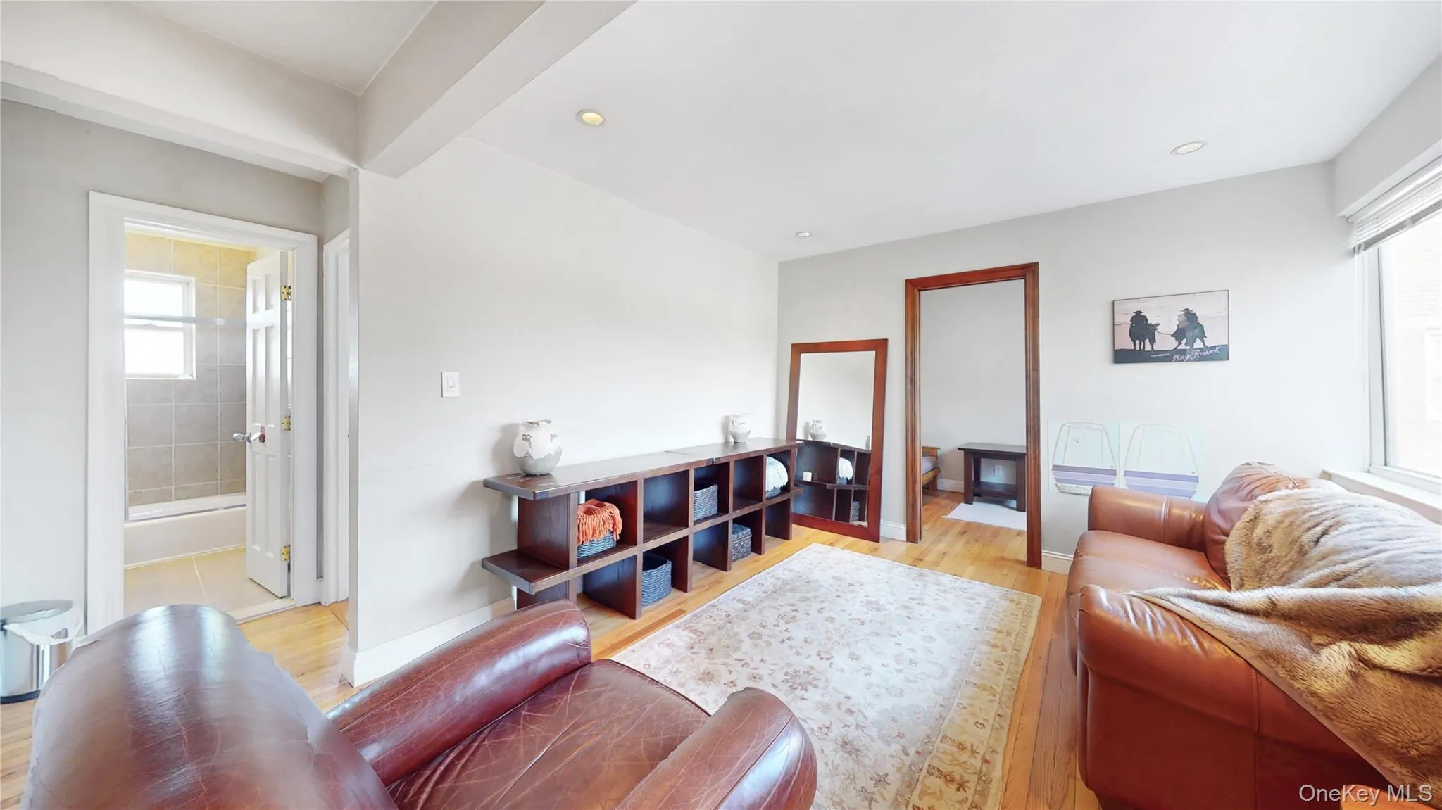 Living area featuring recessed lighting, a wealth of natural light, baseboards, and light wood-type flooring Living area featuring recessed lighting, a wealth of natural light, baseboards, and light wood-type flooring